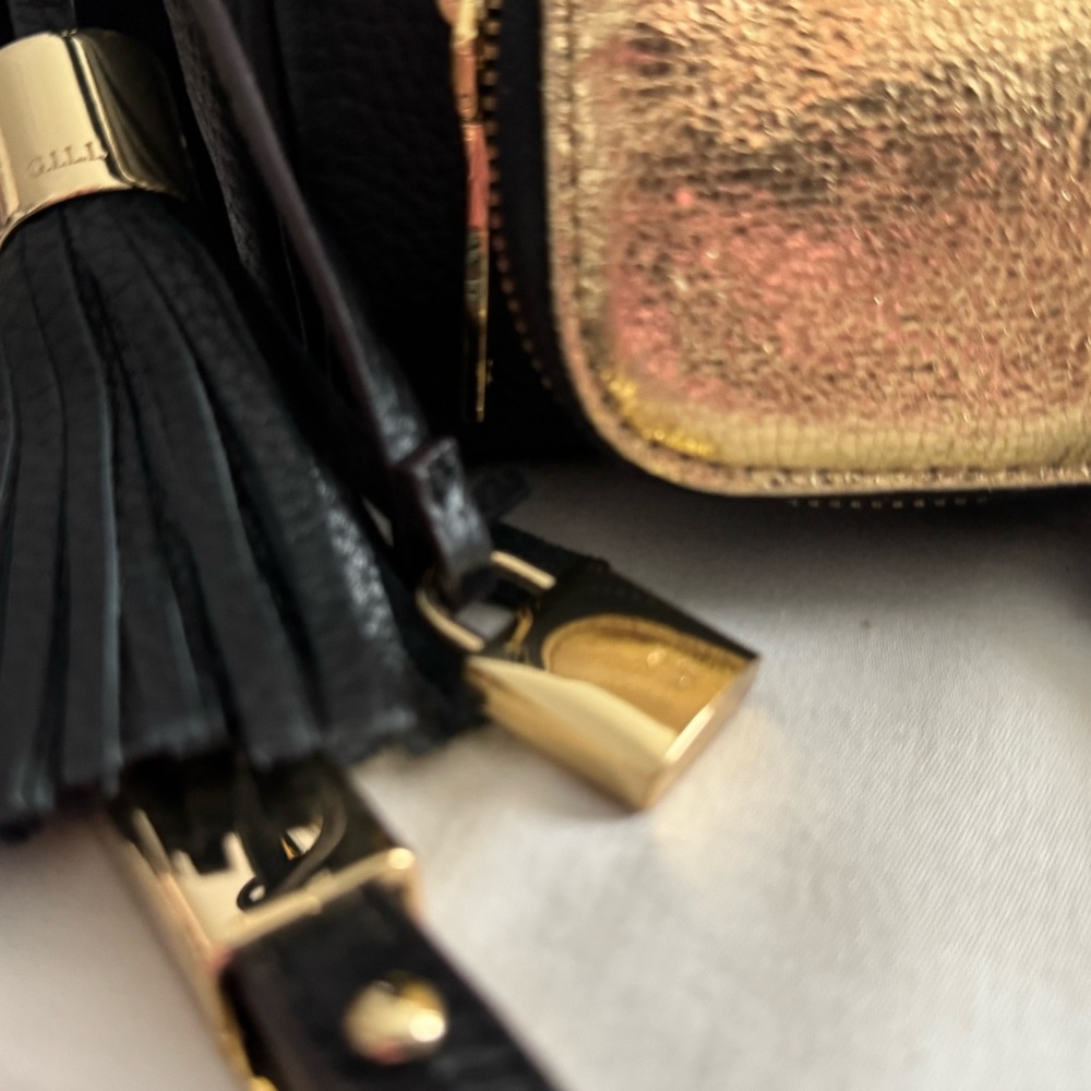 GILI. Black & metallic Gold Handbag.  Black strap Crossbody. “Got It Love It”